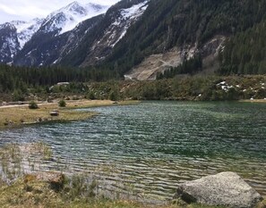 Surrounded by serene waters and majestic mountains, this tranquil lakeside retreat offers breathtaking views.