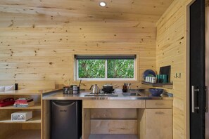 Mini-fridge, stovetop, cookware/dishes/utensils, paper towels