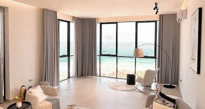 Sand : A Cozy Coastal Escape, & Sea : A Refined Coastal Retreat