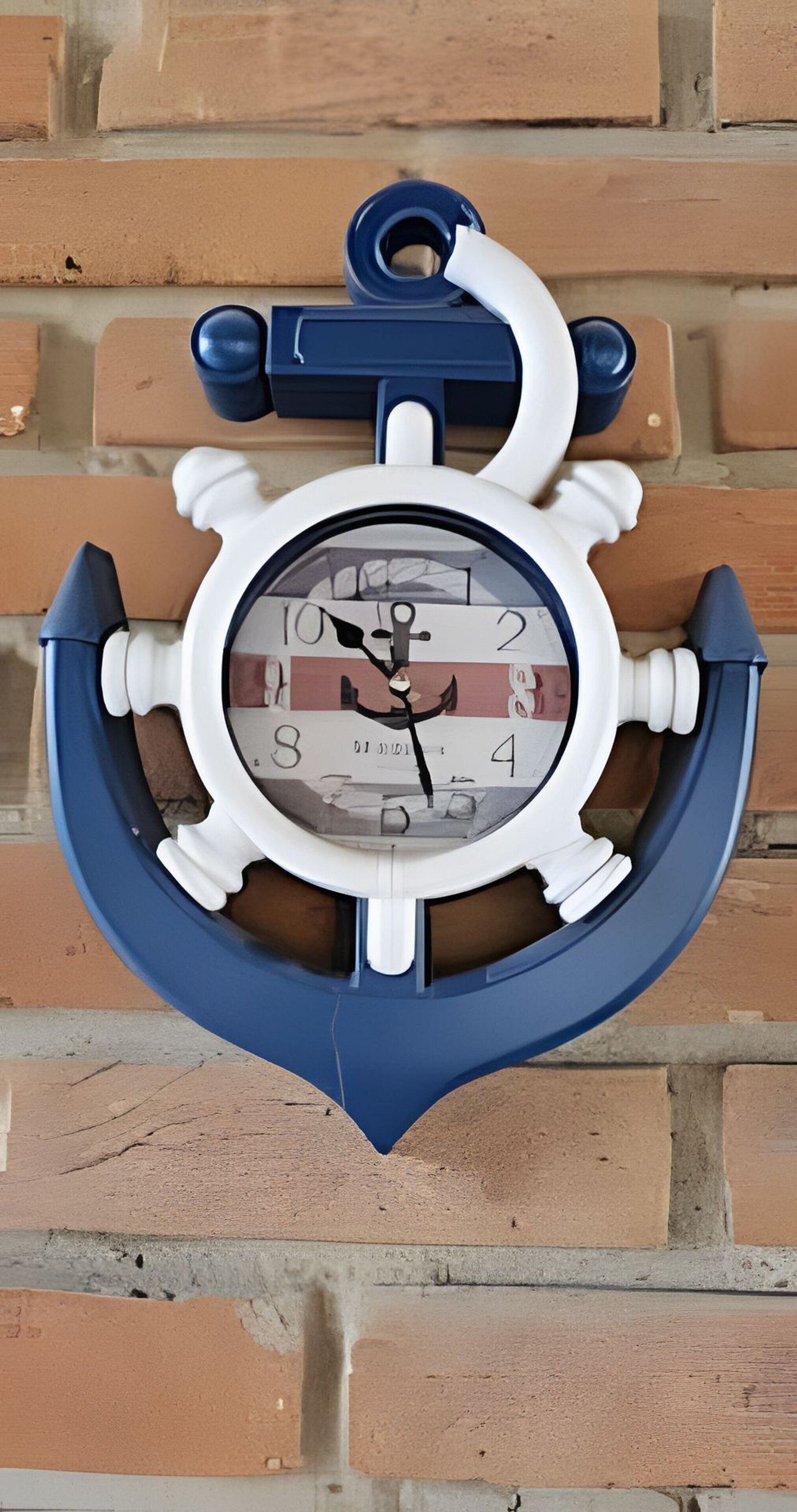 A wall-mounted clock with an anchor design, featuring a white face with black numerals and hands.