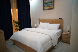 2 habitaciones, tabla de planchar con plancha y cuna de viaje 
