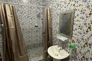 Shower, towels, soap, toilet paper