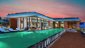 Outdoor pool, open 7:00 AM to 7:00 PM, pool umbrellas, sun loungers