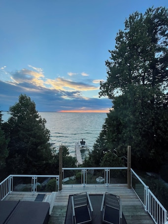 Terrace/patio. Lakefront Cottage w/Hot Tub, BBQ Grill, Patio, Fire Pit, Dock, Sauna, Fire Place
