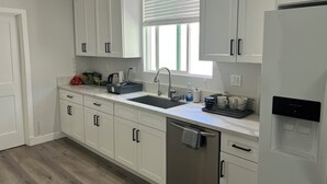 Basic Shared Dormitory, Patio | Private kitchen | Fridge, microwave, oven, stovetop