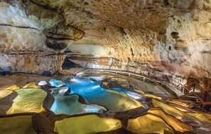 A cave with natural rock formations and a pool of water. - Stunning home in Montclus (Montclus)