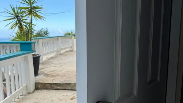 A door with a key lock and a deadbolt. - Bamboo – New Apt. - Downtown/Sea View - Perfect Location (Charlotte Amalie West)