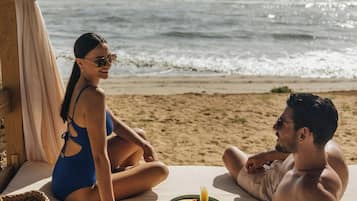 On the beach, beach cabanas, sun-loungers, beach umbrellas