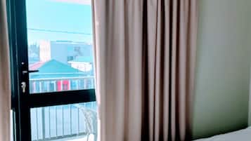 Deluxe Room, 1 King Bed, Balcony, Sea View | Individually furnished, desk, laptop workspace, blackout drapes