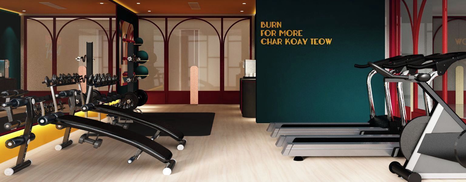 A gym with exercise equipment, a treadmill, and a wall with motivational text.