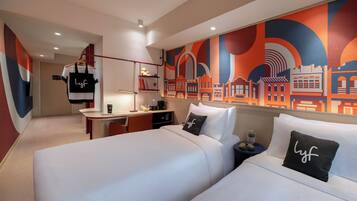 Side by Side Plus | Pillow-top beds, individually decorated, individually furnished, desk