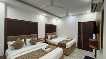 Premium bedding, down duvets, minibar, laptop workspace