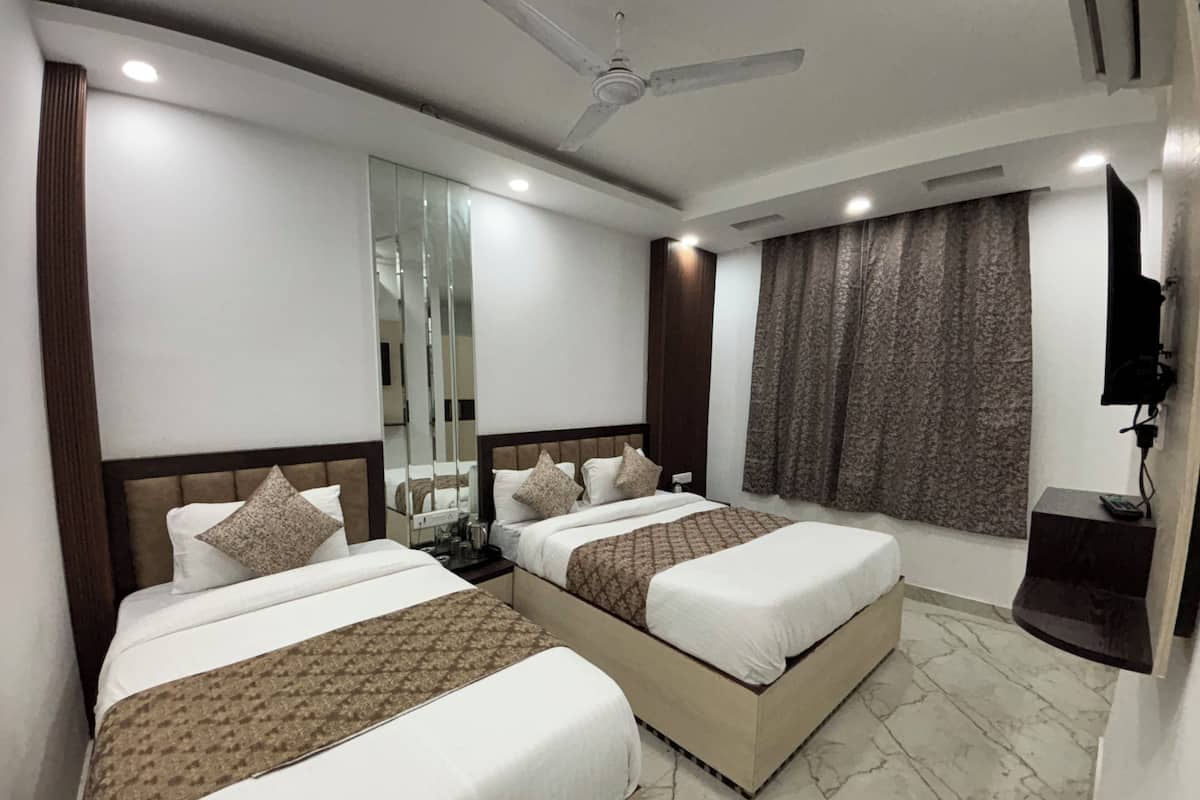 Premium bedding, down duvets, minibar, laptop workspace
