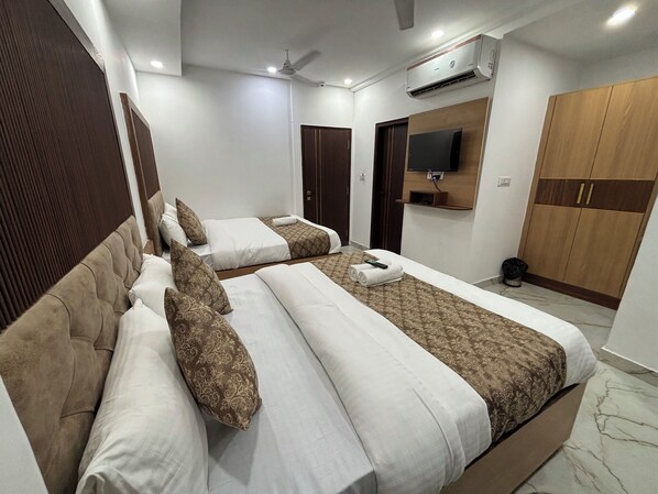 Premium bedding, down duvets, minibar, laptop workspace