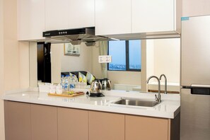 Apartamento família | Área de estar | TV LED 24 polegadas com canais a cabo