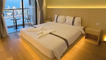 Deluxe King Balcony River View | Memory-foam beds, in-room safe, individually furnished