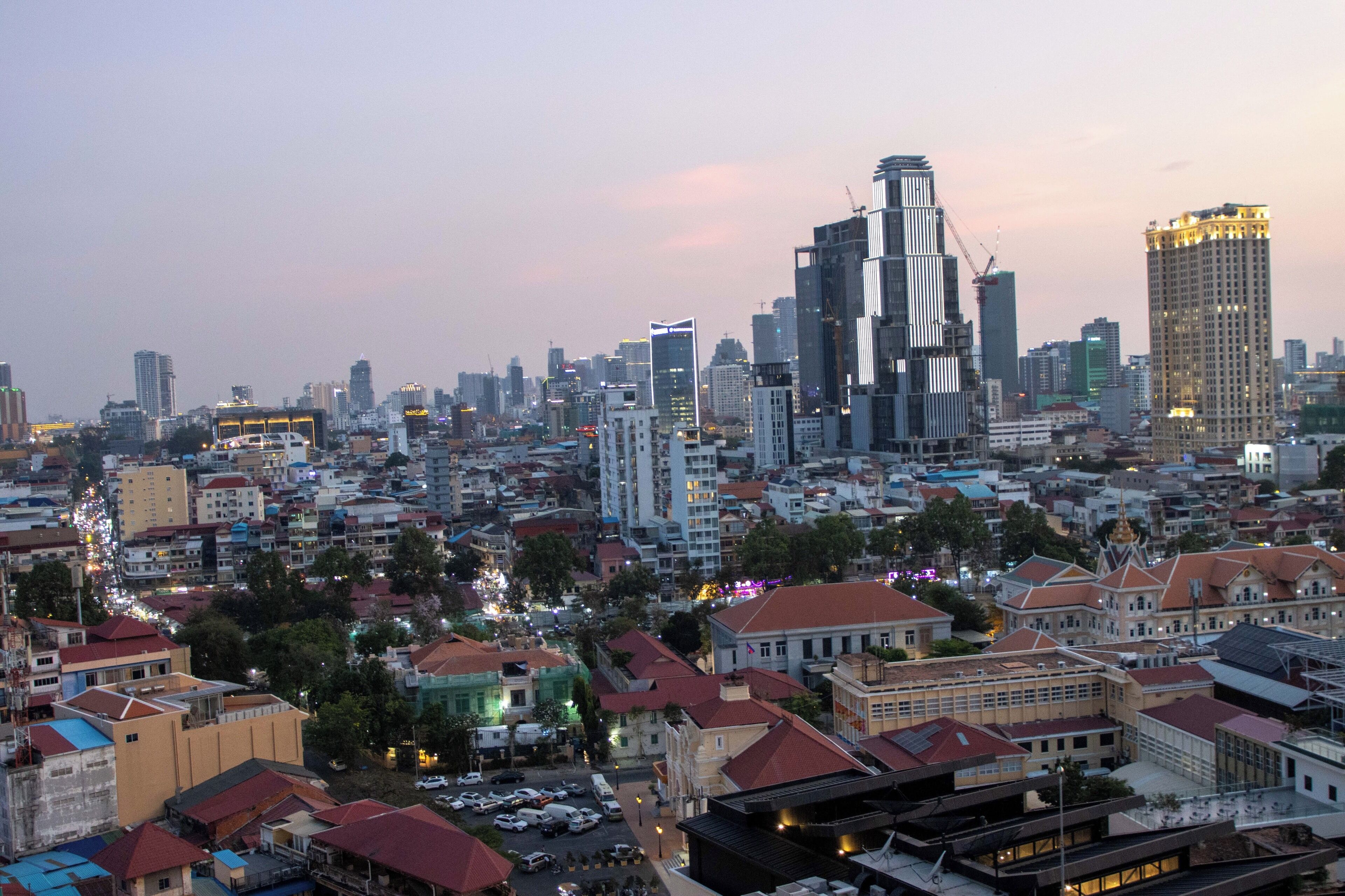 A cityscape with a mix of modern and traditional buildings, a variety of architectural styles, and a dense urban layout.