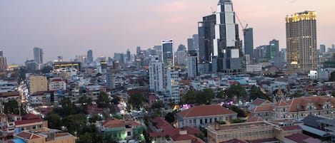 A cityscape with a mix of modern and traditional buildings, a variety of architectural styles, and a dense urban layout.