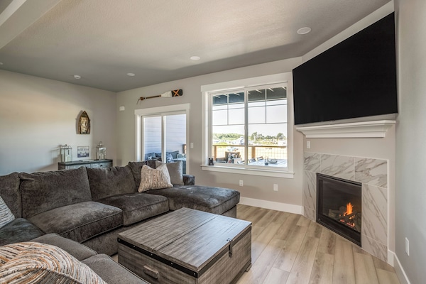 Living room. Feather lined sectional for 7 people. Gas fireplace. 77" OLED TV