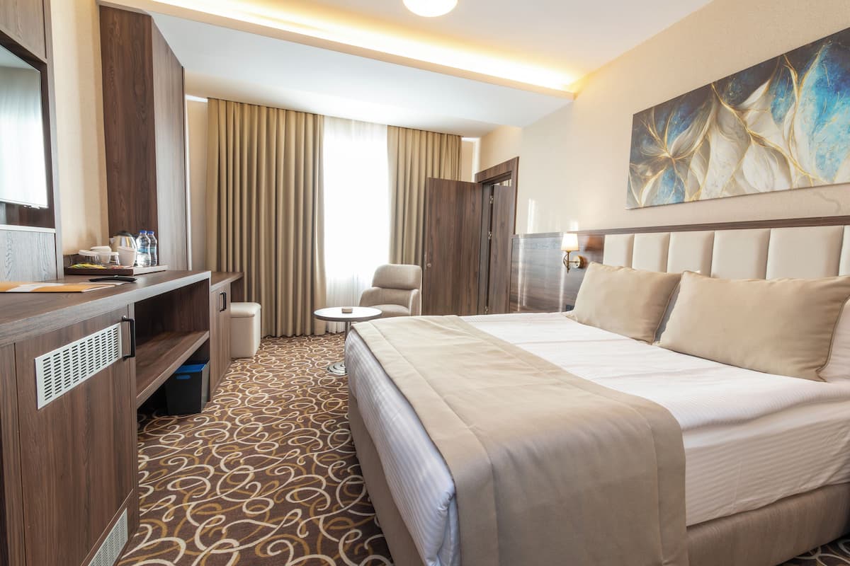 Family Room | 1 bedroom, premium bedding, minibar, in-room safe