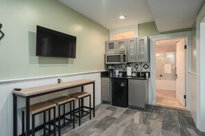 Fridge, microwave, coffee/tea maker, cookware/dishes/utensils