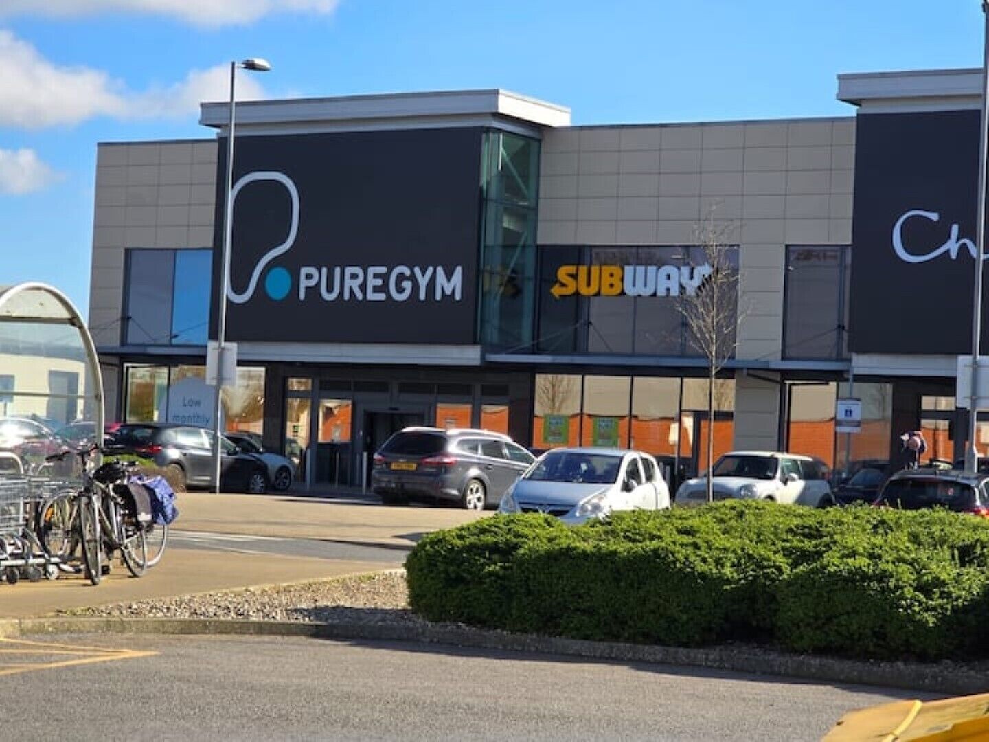 A shopping center with a PureGym and Subway store.