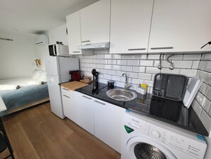 Fridge, microwave, stovetop, coffee/tea maker