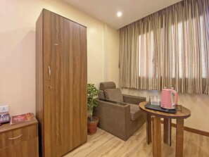 Deluxe Studio Suite, City View | Living area | TV - Hotel Airport Holiday (Kathmandu)