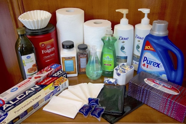 A variety of household items including paper towels, cleaning supplies, and personal care products.