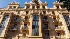 A classical building with ornate architectural details, multiple balconies, and large windows. - Colectia Stays Gran Vía (Madrid)