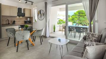 Apartment, 2 Bedrooms | Living area | Flat-screen TV