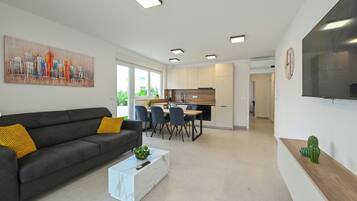 Classic Apartment, 2 Bedrooms, Poolside | Living area | 45-inch flat-screen TV with satellite channels