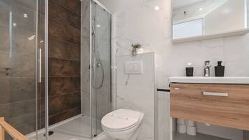 Apartment, 2 Bedrooms, Balcony | Bathroom | Shower, hair dryer, towels, soap
