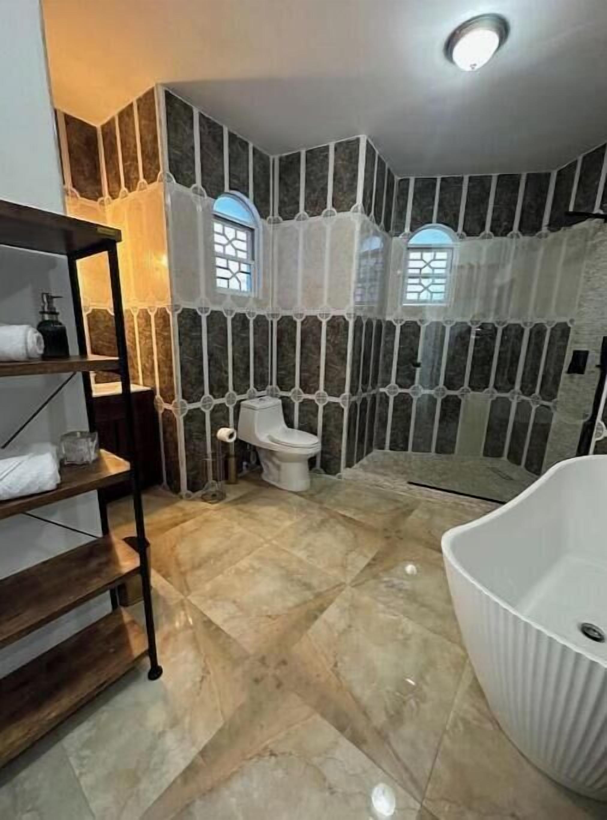Shower, towels, soap, toilet paper