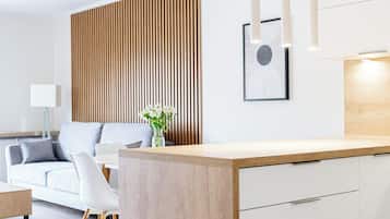 Apartment, Balcony, City View | Living area | 42-inch Smart TV with cable channels