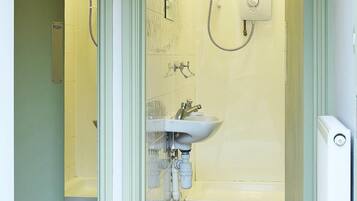 Shower, towels, soap, toilet paper