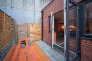 outdoor space with a kitchen area and casual dining area.