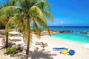 On the beach, sun loungers, beach towels