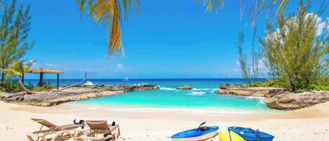 On the beach, sun-loungers, beach towels