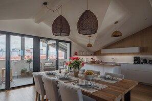 Apartment | Living area | 130-cm Smart TV with digital channels, books