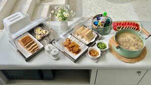 A breakfast buffet with various food items and a toaster.