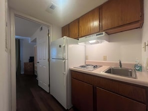 Fridge, microwave, stovetop, coffee/tea maker