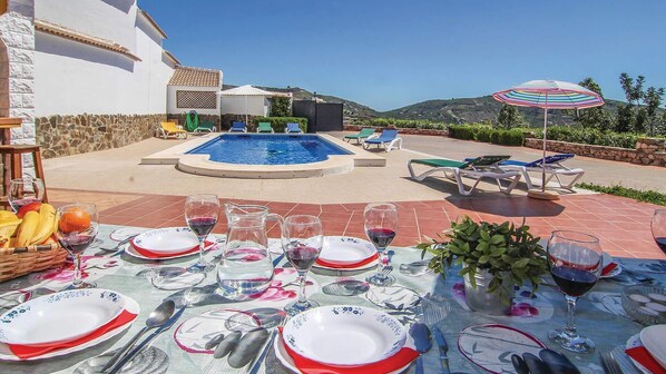 Enjoy al fresco dining with a refreshing pool view.