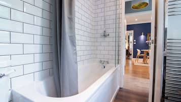 Shower, hair dryer, towels, shampoo