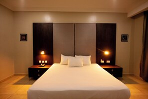 In-room safe, desk, laptop workspace, blackout curtains - Genesis Hotels (Port Harcourt)