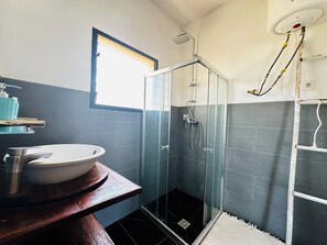 Shower, towels, soap, toilet paper