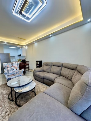 Business Apartment | Living area | 34-inch Smart TV with digital channels