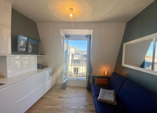 Parisian Attic Studio—View of Rooftops and Landmarks  