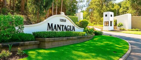A well-maintained sign with the name 'MANTAGUA' and a number '12010' indicating a property or location.