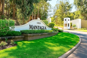 A well-maintained sign with the name 'MANTAGUA' and a number '12010' indicating a property or location.